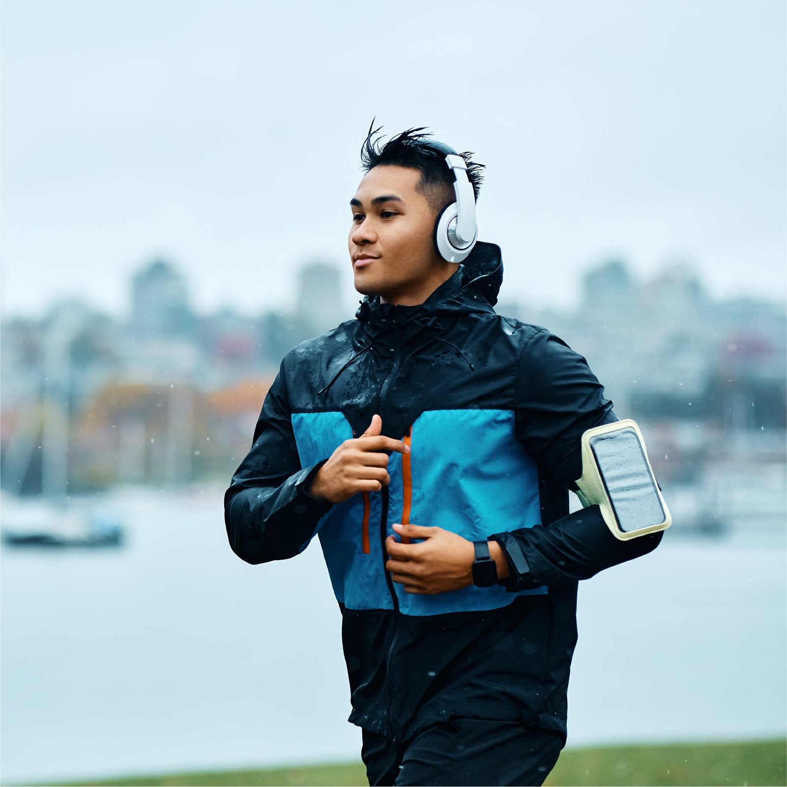 Man jogging outdoors with headphones